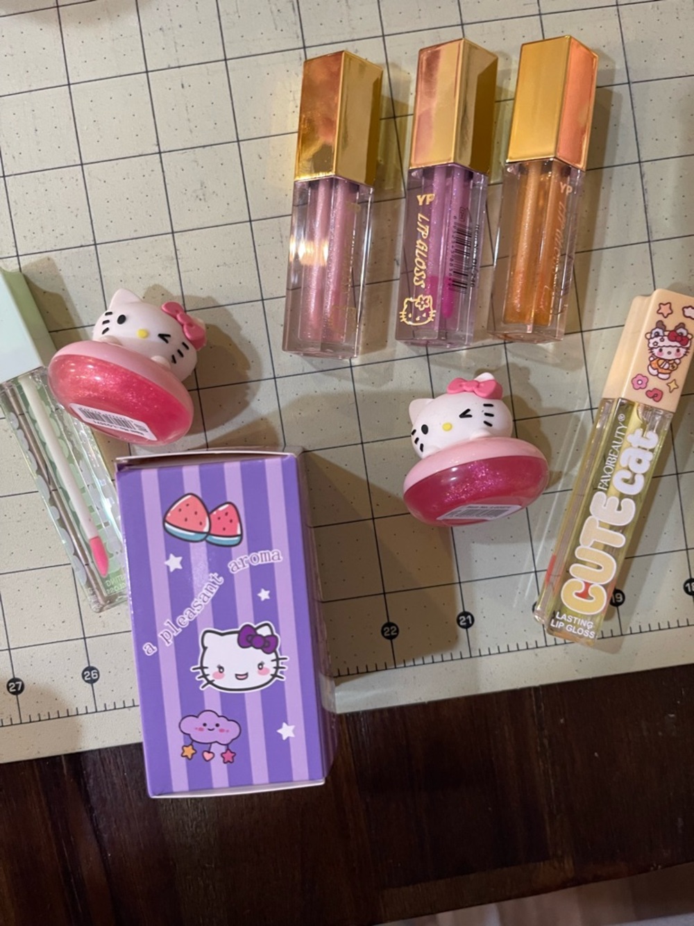 Hello Kitty themed Lip Gloss, balm, perfume in Pink, Purple, Gold